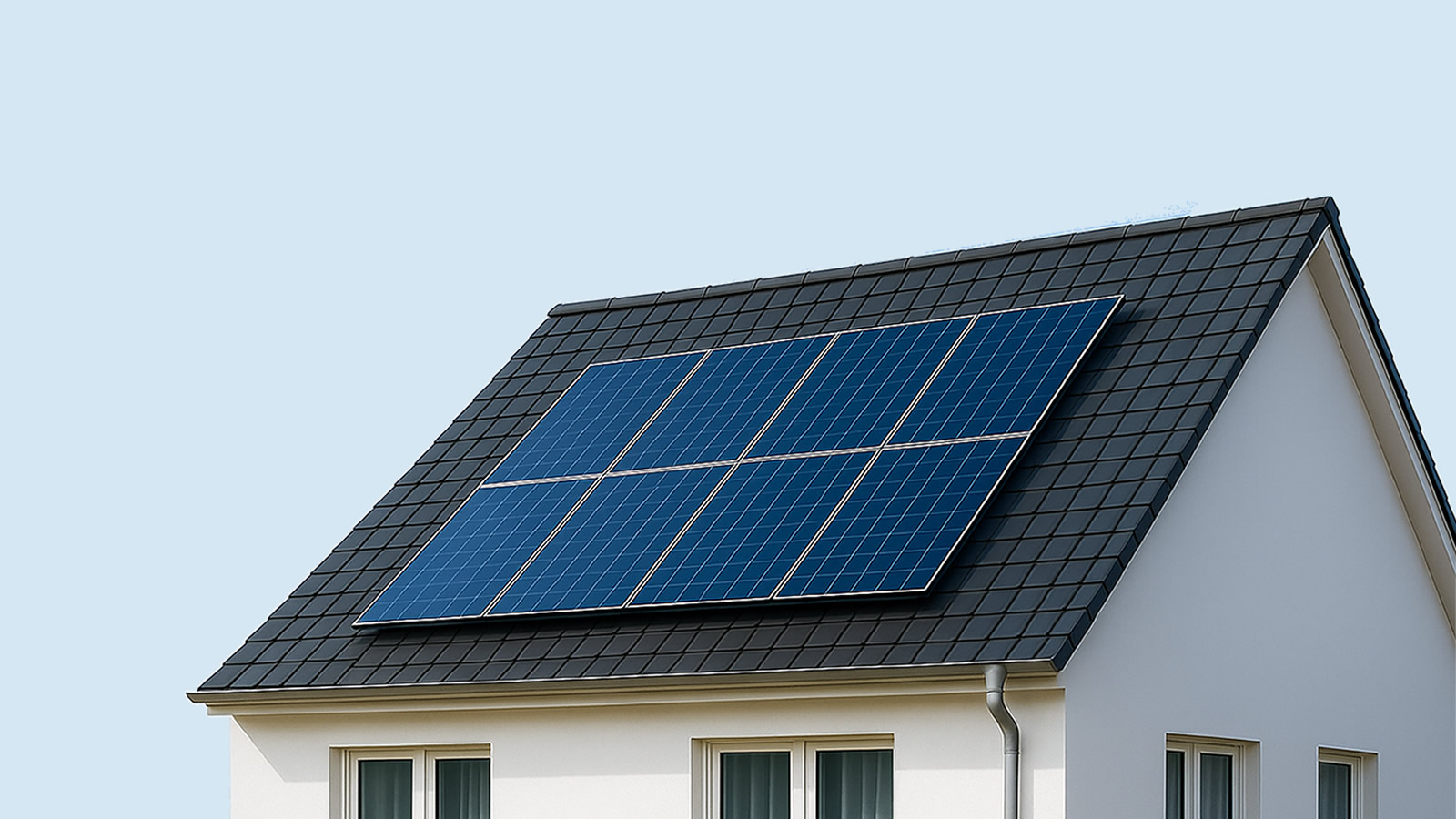 Modern UK home with rooftop solar panels, clear sky